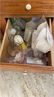 Assorted kitchen utensils (measuring cups,