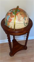 World globe on wooden ornate base