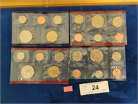 Four mint coin sets