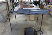 metal table frame and metal pieces. table is