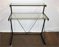 Metal base glass top desk with step up back