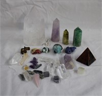 Assorted crystal points, animal figurines, pyramid