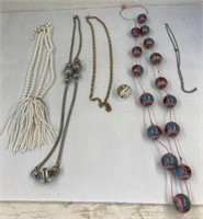 Lot of necklaces and a charm
