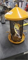 Tube style bird feeder