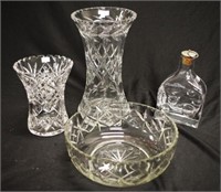 Two cut crystal vases, a cut glass bowl
