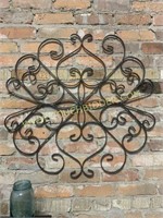 Vintage scrolled iron wall medallion