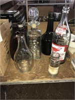 COLLECTION OF GLASS BOTTLES AND DECANTERS