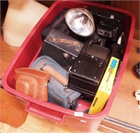 Container of vintage and contemporary cameras