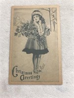 Christmas greetings postcard woman holding roses