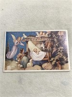 Christmas postcard of manger with Baby and angels
