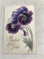 Postmark 1908 a joyful new year embossed purple