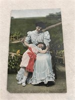 Postmark 1908 fancy lady with child postcard