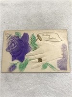 Postmark 1909 embossed birthday greetings purple