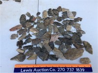 Assortment of broken arrowheads and stones ready