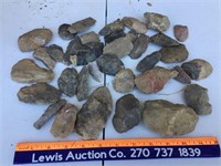 Assortment of broken arrowheads and stones ready