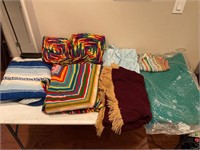 A Group of Various Blankets and Afghans