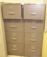Two four drawer brown file cabinets