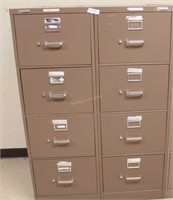 Two Four drawer brown file cabinets
