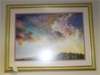 Framed and glazed print of Clouds in sky over fore