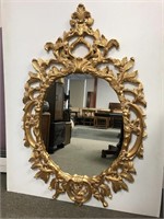 Highly decorative gold wall mirror