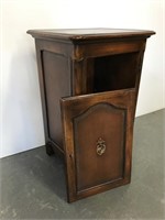 Cabinet with royal crest on top and door