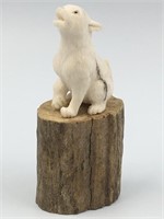 Antler carving of a pup on antler base