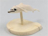 Walrus ivory carving of a dolphin