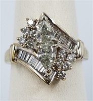 14K trillion, baguette, and round cut diamond ring