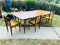 table with 3 leaves and 6 chairs