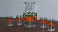 Vintage orange juice decanter with four glasses