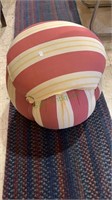 Burgundy and white striped ottoman footstool.