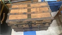 Antique flat top steamer trunk with the latches,