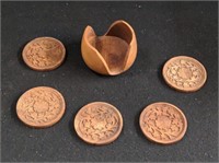 Group of carved wooden coasters