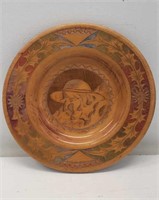 Signed carved wooden plate