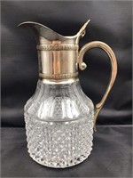 Cut glass pitcher approximately 9" x  5”