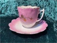EARLY GERMAN TEA CUP AND SAUCER