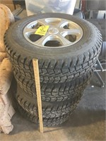 (4) ford escape studded tires on rims