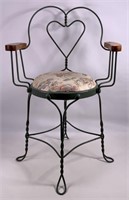Youth arm chair, bent iron frame has heart back,