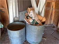 2 barrels and random tin pieces, lumber tarps