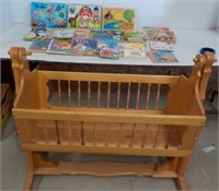 Wooden Rocking Crib and Fun Books.