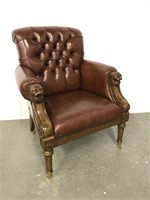 Stately Tufted back carved arm chair