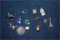 Twelve Charms and One Earring  - Some Silver