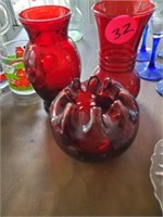 TWO RUBY VASES AND CANDLE DISH