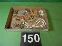 Flat Of Jewelry With Brooches