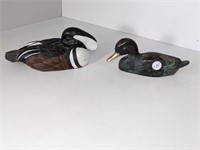 un canard en fer et un en céramique