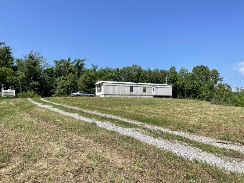 1+/- Acre Lot &  Neglected Mobile Home