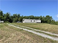 1+/- Acre Lot & Neglected Mobile Home