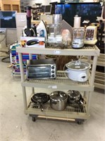 Rack of small kitchen appliances pots and pans