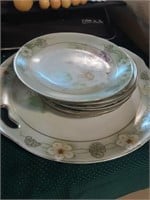 Decorative floral plate and saucers