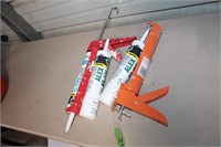 LOT OF CAULKING GUNS AND MISC CALKING